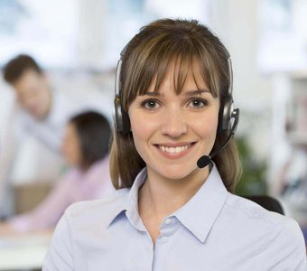 A friendly patient care advisor wearing a headset