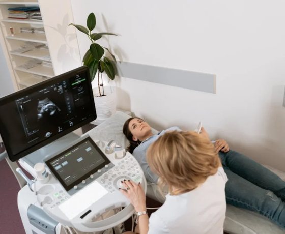 A caring ultrasound appointment with a mother and child